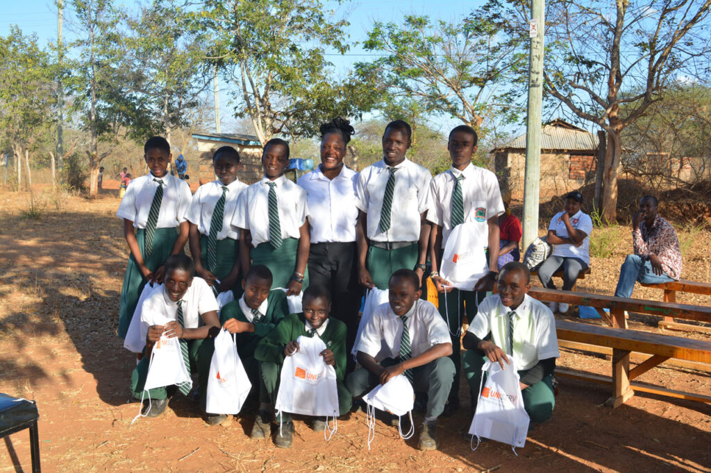 A group of students posing together for a photo in the playground
